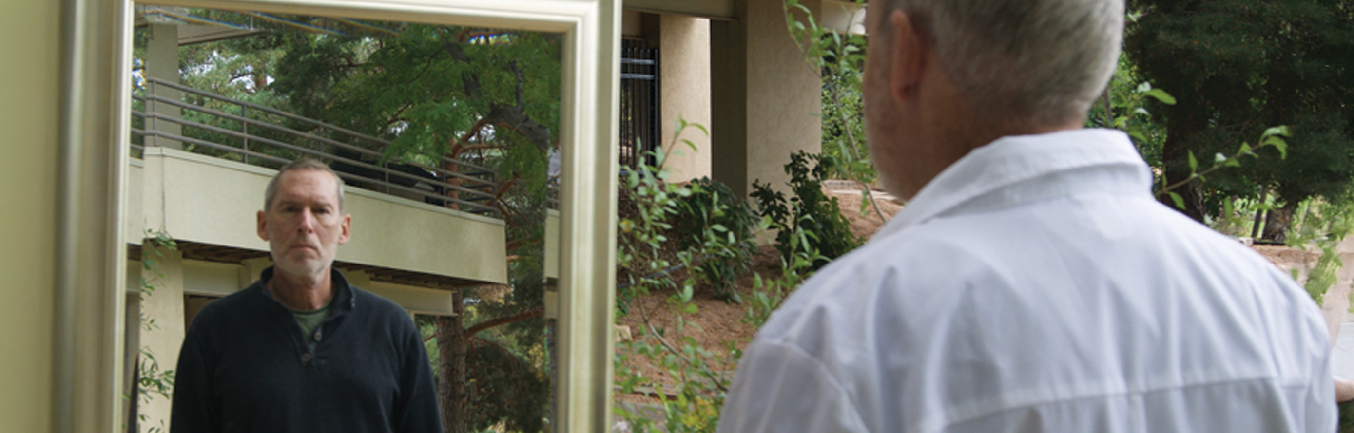 Man standing in front of a mirror.