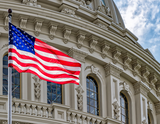 Image: U.S. Capitol building with USA flag in front